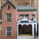 Dolls house 62cm high, 60cm wide and 29cm deep with opening front and rood plus a large amount of