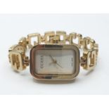 Ladies Guess wristwatch. Swiss made having rectangular face and quartz movement. Full working order.