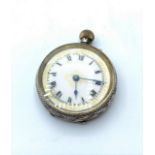 Antique silver ladies open face pocket watch, having chased scroll engraving, top winding with