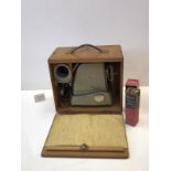 1950s slide projector in wooden carrying case
