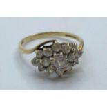 9ct gold gemstone cluster RING having sparkling stones in large flora formation to top. Full UK