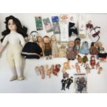 A Large Quantity of Small Vintage Dolls Inc: Porcelain, Plastic, Etc.