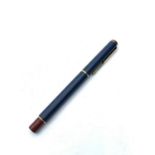 Parker ball pen in navy blue and burgundy with gold colour trim, complete with matching Swede fabric