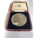 A cased George and Mary Jubilee medal in fine condition.