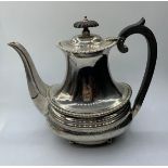 A Regency style silver tea pot with a London 1904 Hallmark good overall condition, weight 704g and