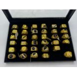 34 x Men's costume RINGS in box.