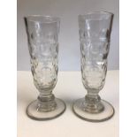 Two Georgian hand blown glasses of tapered cylindrical form on a wide foot and polished pontils,