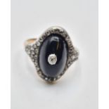 Antique diamond encrusted black enamel ring with small centre diamonds,5 grams & size M.