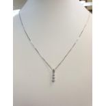 18CT W/G 3 STONE DIAMOND PENDANT ON CHAIN 0.14CT, WEIGHT 1.5G AND 45CM LONG APPROX