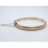 Vintage 9ct gold bangle with safety chain, weight 8.3g
