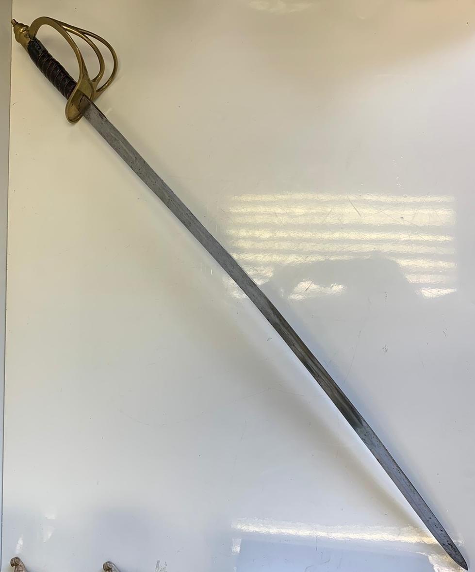 Antique sabre sword for light cavalry officer with leather bound handle and brass hilt