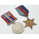 Pair of World War II original medals to include the 1939-1945 Star and the 1939-1945 medal. Complete