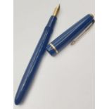 Vintage Parker fountain pen. Blue with gold trim. Screw top model suction filling. 14ct gold nib