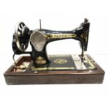 Singer sewing machine classic black design with gold decoration circa 1910 with hand turned