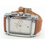 Large square faced wristwatch with the name Emporio Armani and Armani logo to face, light brown