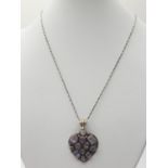 Silver heart shaped pendant and silver chain, pendant encrusted with amethyst of various shapes,