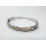18ct White Gold Hinged Bangle with Channel Set Diamond ( 0.90ct) and Yellow Sapphire Designed by