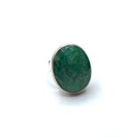 An emerald ring in sterling silver , size R
