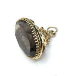 Vintage yellow metal seal pendant/charm with smokey Quartz stone. 10.6g