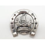 Vintage Scandinavian silver brooch having a Viking longship and the word Norge in a silver horseshoe