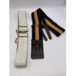 2 military belts. One painted white dress belt and the other is the princess of Wales regiment belt