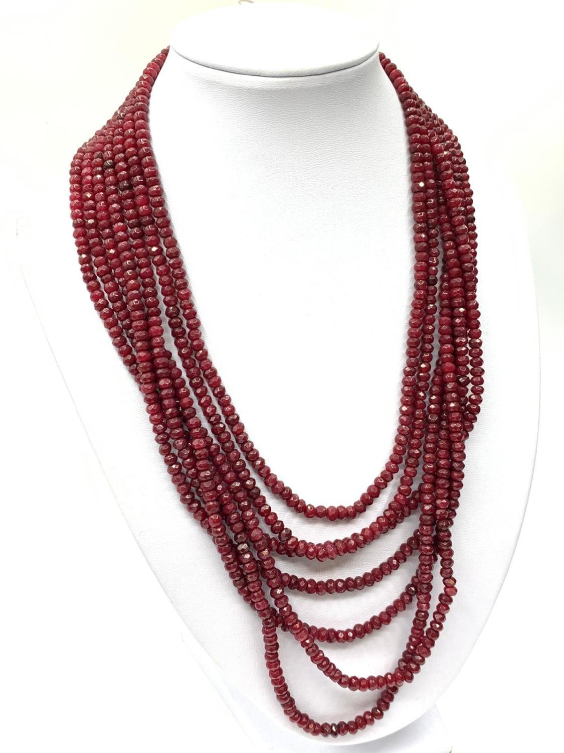 An impressive seven row multi-faceted ruby necklace, Length 44-60cm Weight: 106 g. Rubies are colour
