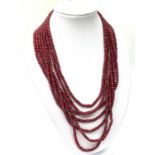 An impressive seven row multi-faceted ruby necklace, Length 44-60cm Weight: 106 g. Rubies are colour