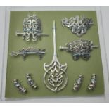 A collection of Art Nouveau and Viking or Celtic style hair clips, pins and beard beads. Some are