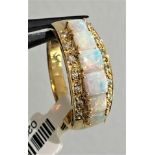 18k yellow gold ring with diamonds 0.08ctd and opals ( stones from 3.3x3.3mm to 4x4mm); weight 4.1g;