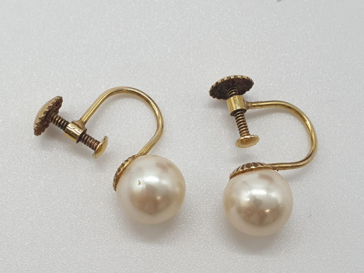 9ct gold vintage pearl earrings, having screw fitting and marked for 9ct, original box and good