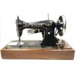 Early electric Singer sewing machine in carrying case