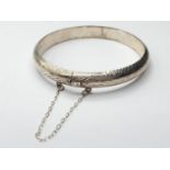 Silver BANGLE with safety chain. 11.8g