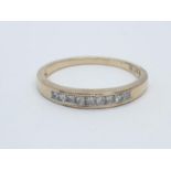 9CT Y/G DIAMOND CHANNEL SET HALF ETERNITY RING , WEIGHT 1.5G AND 0.25CT APPROX SIZE N1/2
