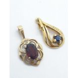 2 x 9ct gold PENDANTS with stones. 1.4g