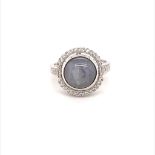 18ct white gold ring with 5.5ct round miligrain halo star sapphire, 0.25ct side diamonds (F/G colour
