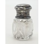 Vintage silver topped cut glass smelling salts bottle, clear hallmark for makers Wolfsky & Co London