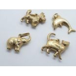 4 x 9ct gold PENDANTS/CHARMS . 2.5g