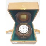 Baume and Mercier, lockable with key Geneve gimballed travelling CLOCK, in walnut case, Quartz