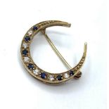 9ct gold Horseshoe BROOCH with diamonds and sapphires. 2.2g