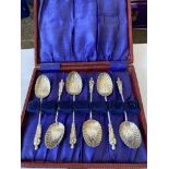 Set of 6 Silver apostle coffee spoons. Each spoon having twisted handle and scalloped shell bowl.