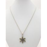 Silver peridot and marcasite flower pendant on silver chain, pendant consisting 6 faceted peridot