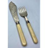 Ornate silver bladed Fish serving knife and fork with ivory handles dated 1896 Sheffield made by