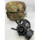 A British army issue gas mask in original camouflage knapsack, size 30x24cm