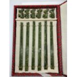 A Chinese set of six pairs of carved jade chop sticks with assorted rests in the shape of lions in