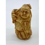 Ivory CHINESE Budha hand carved with fan. 8cm tall. circa 1880.