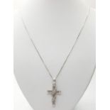 Silver cross in modernist form on a fine silver box chain, silver cross having two diagonal strips