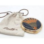 Retro Stratton compact having enamelled lid in art deco design, glossy black and amber finish,