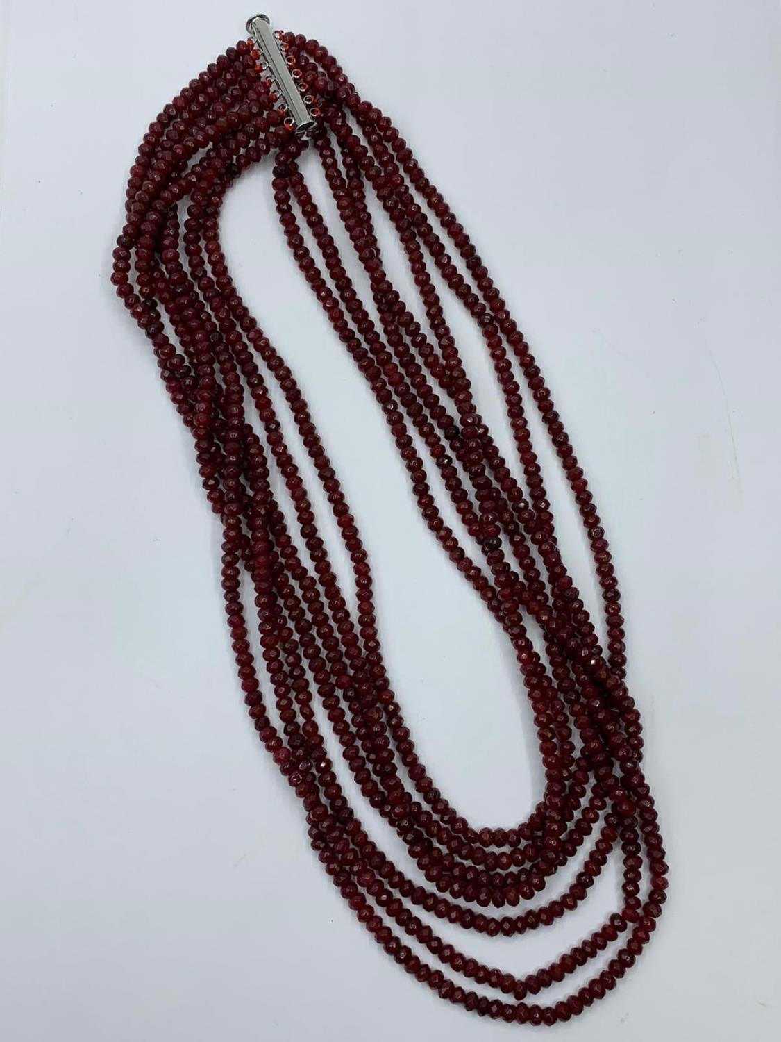 An impressive seven row multi-faceted ruby necklace, Length 44-60cm Weight: 106 g. Rubies are colour - Image 2 of 4