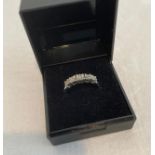 Silver and diamond ring having five diamond points square mounted with illusion setting in half hoop