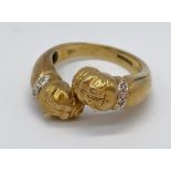 A bulldog ring in 9ct gold with diamond collars, weight 7.9g & size U